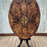 The small side with the intricate design in the veneer - after