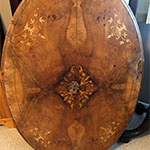 The small side with the intricate design in the veneer - before